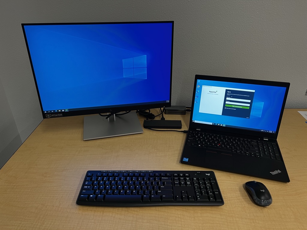 Laptop on desk with monitor